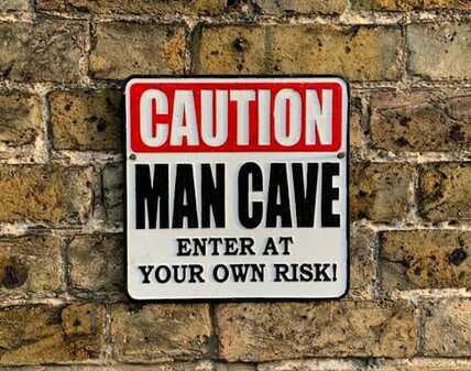 Caution man cave sign